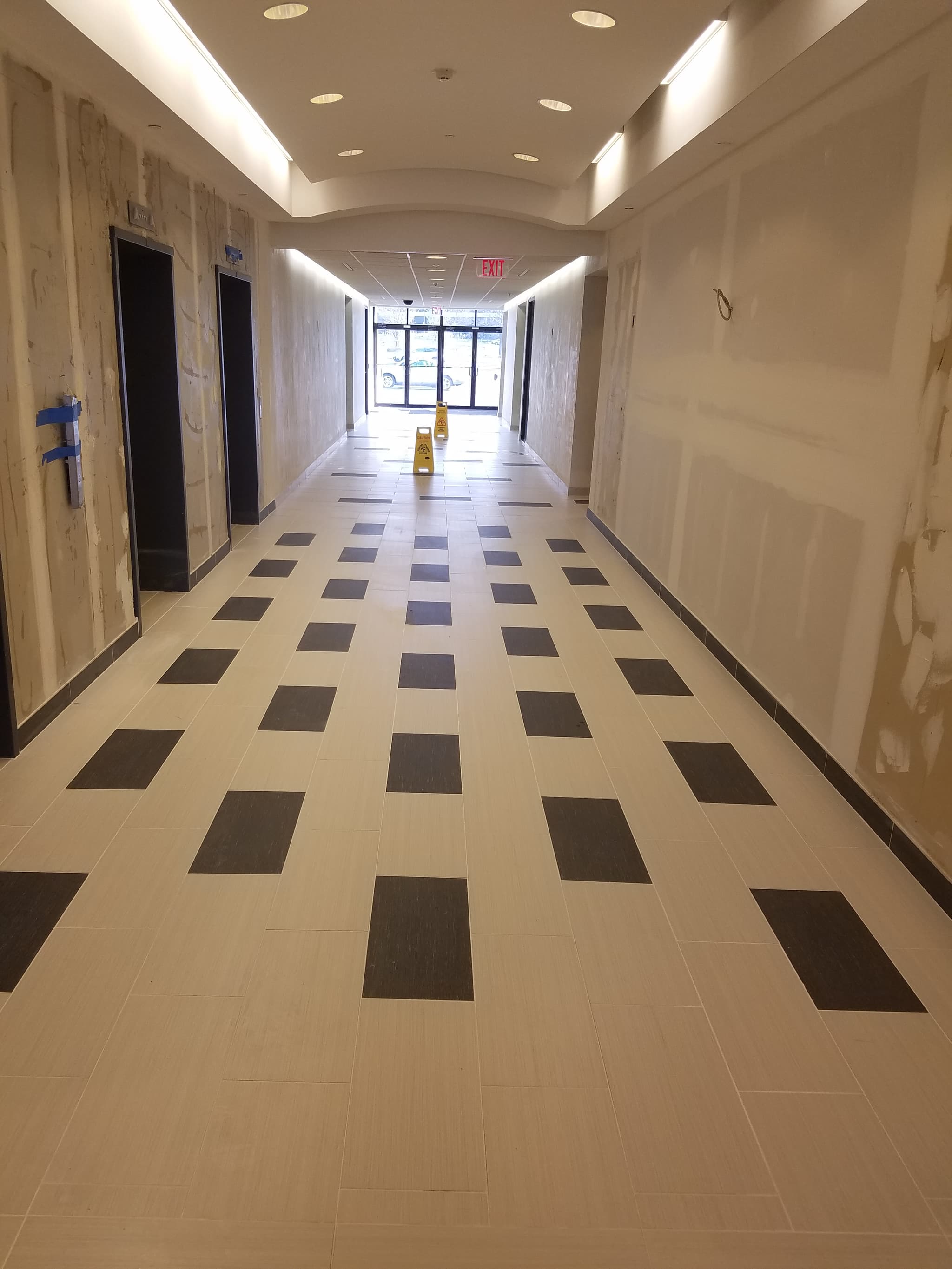 Commercial hallway tile floor installation