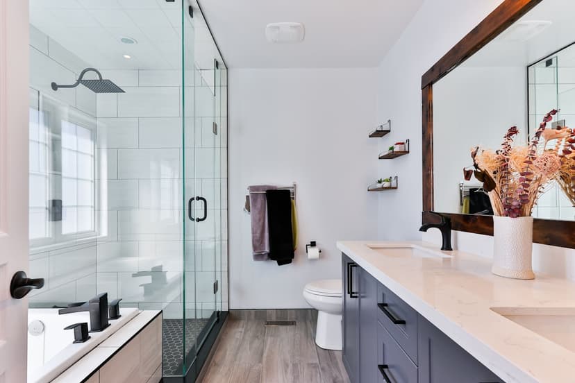 Elegant curbless shower with integrated grab bars and built-in bench